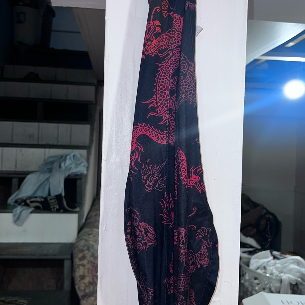 Same wrap around style as the blue top- black and red dragon wrap around halter